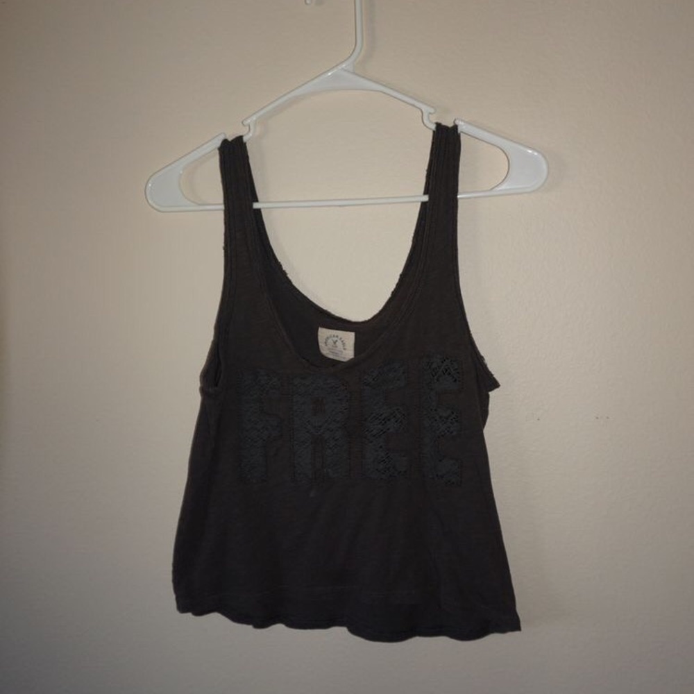 Tank top says “free”